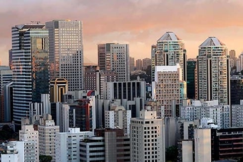 A city skyline with tall buildings. Cooperation - Inter-American Development Bank - IDB