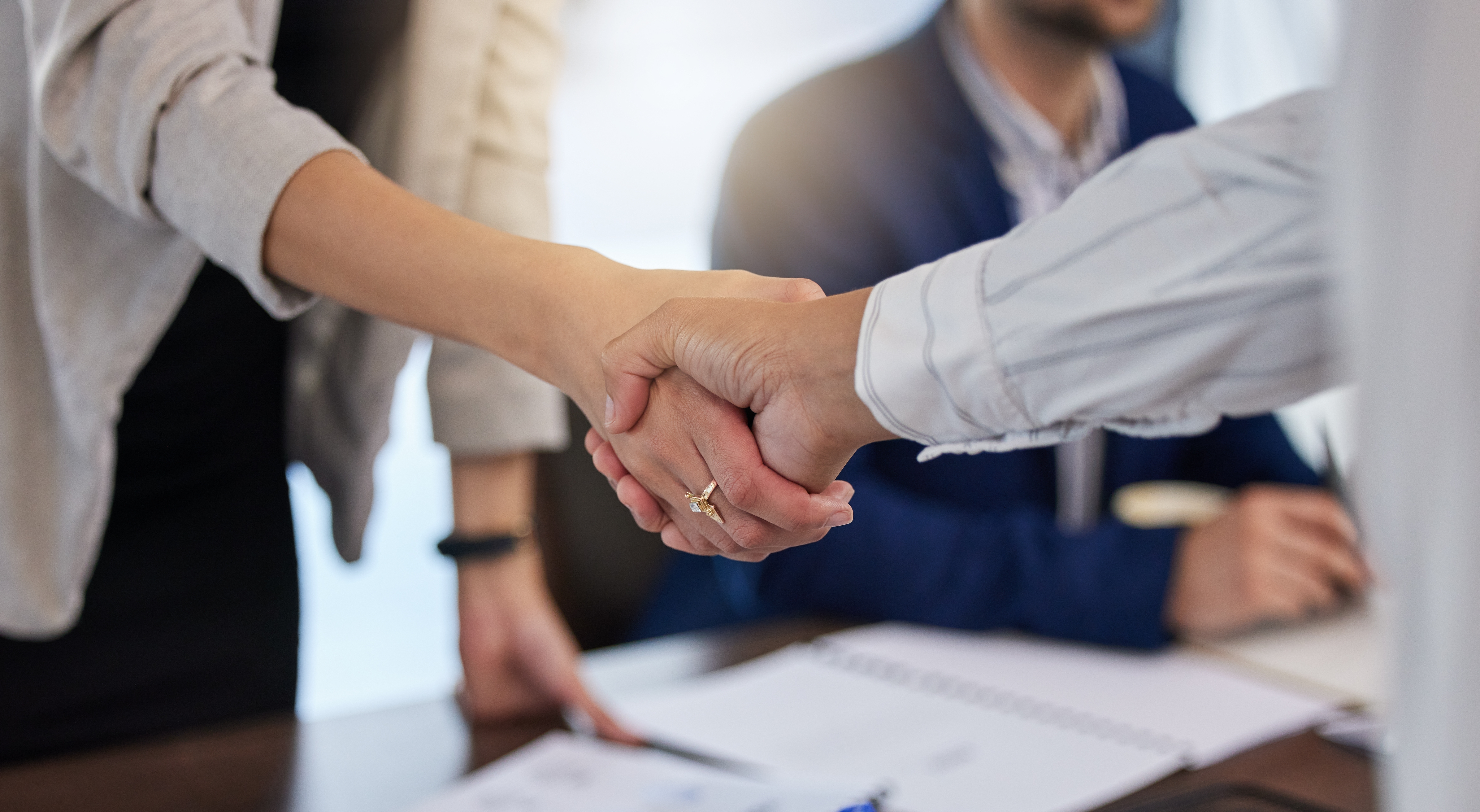 Two people shaking hands - Inter American Development Bank - IDB Biodiversity