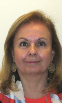 a person with long hair wearing earrings Sanctions - Inter-American Development Bank - IDB