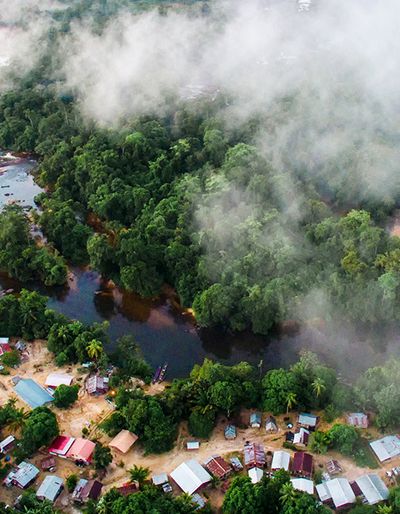 Aerial view of a rural community along a river.