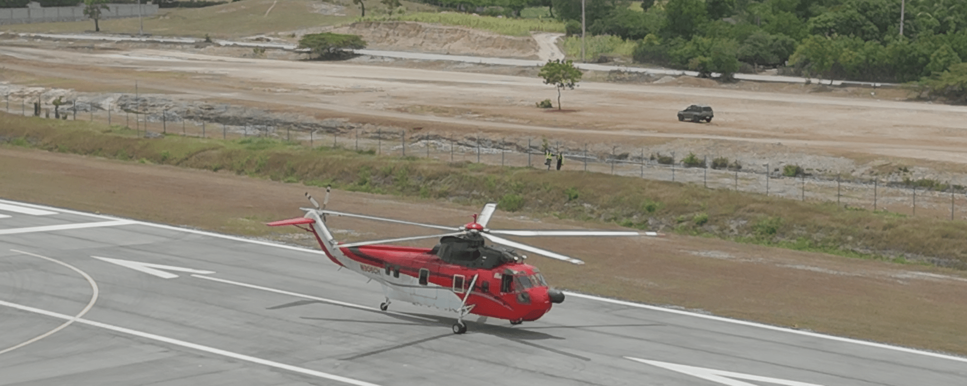 Helicopter on an airport runway - Inter American Development Bank - Air Transportation