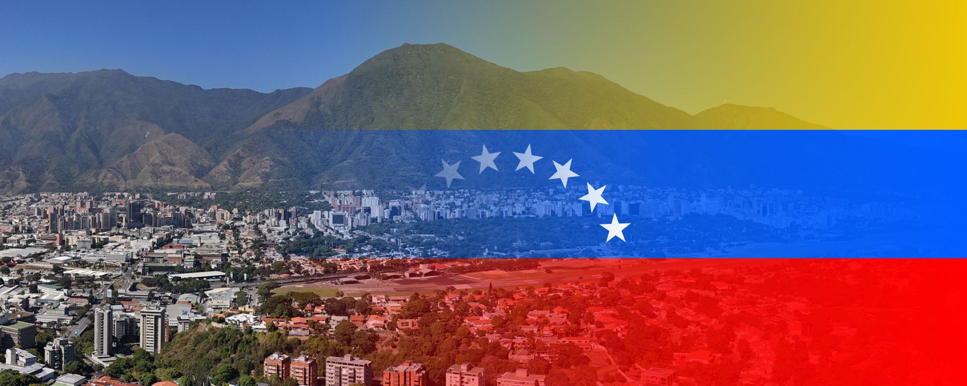 Panoramic day view of a city with mountains on the horizon - Inter American Development Bank - IDB Group