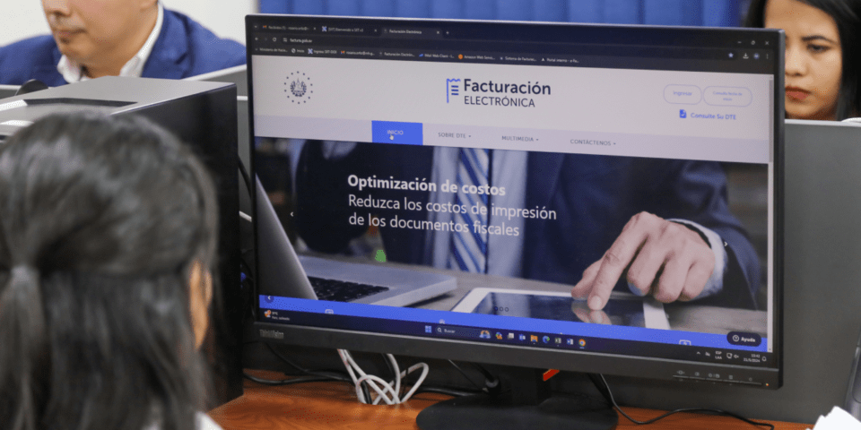 People writing on computers in an office - Inter American Development Bank - IDB Fiscal Management