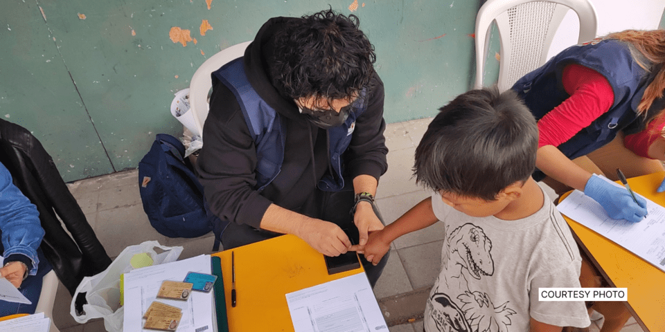 Child registering their finger prints - Social Initiatives- Inter American Development Bank - IDB