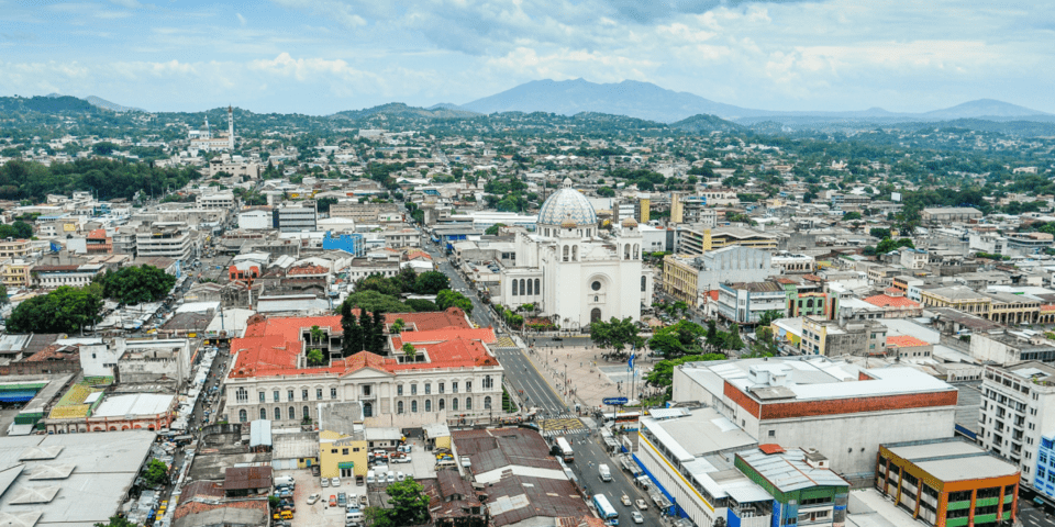 Panoramic day view of a small city with mountains on the horizon - Inter American Development Bank - Productivity Growth