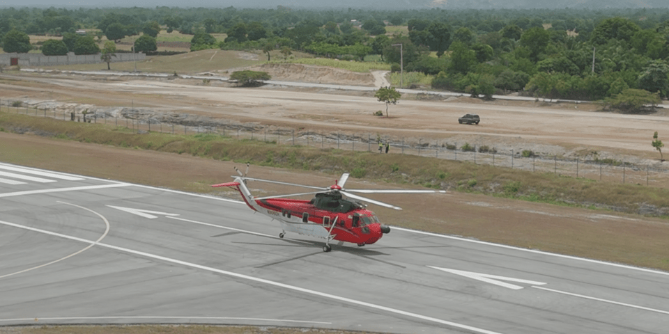 Helicopter on an airport runway - Inter American Development Bank - Air Transportation