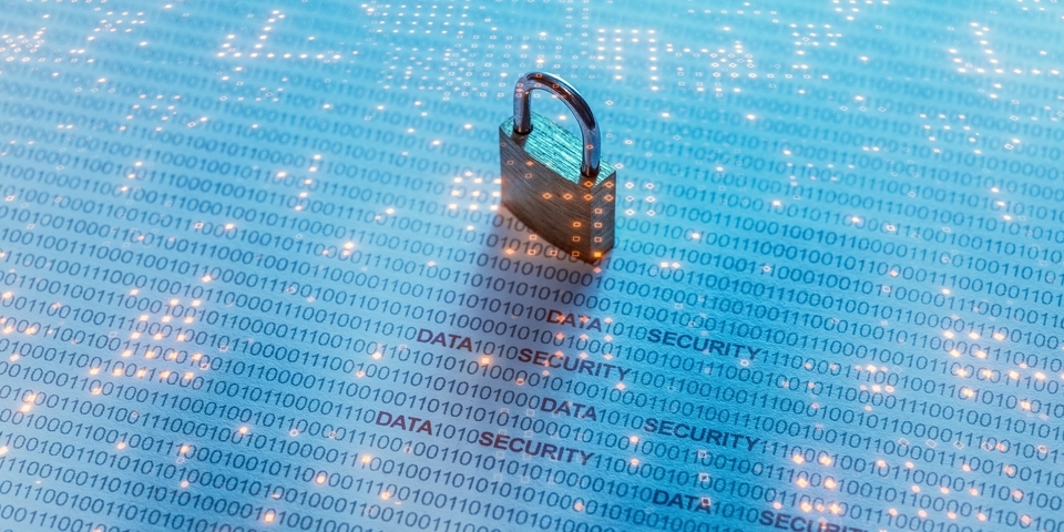 A padlock on a luminous surface reminiscent of an electronic circuit board.