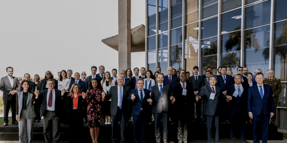 Executives standing outside a building - Inter American Development Bank - Citizen Security
