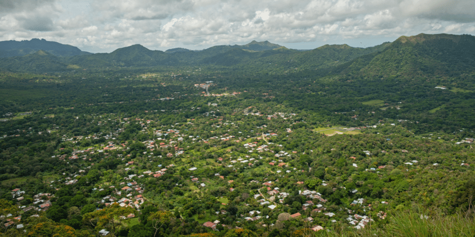 Aerial view of rural communities surrounded by forested mountains in Panama IDB