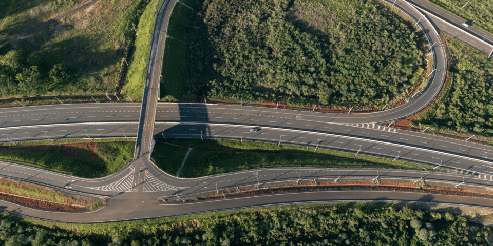 Aerial view of a highway interchange illustrating transportation infrastructure and regional connectivity IDB