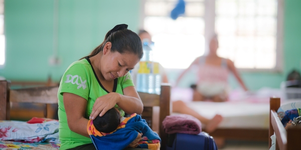 Mother holding her baby in a hospital setting