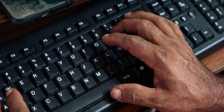 Image of a man's hands typing on a keyboard - Inter-American Development Bank - IDB