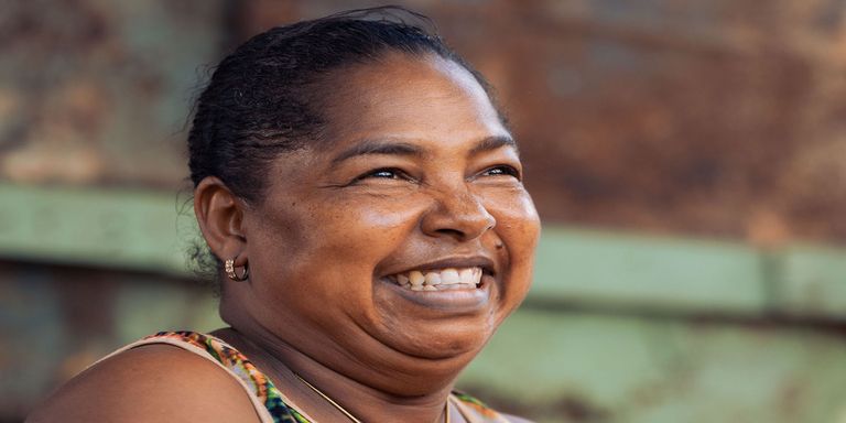 A close-up of a woman smiling. Environment - Inter-American Development Bank - IDB