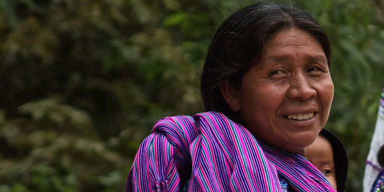 a person with a purple scarf Financing - Inter-American Development Bank - IDB