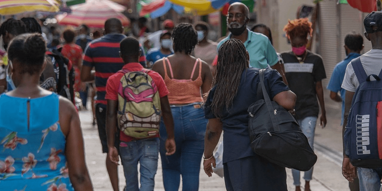 Back view of a Group of people walking in a street