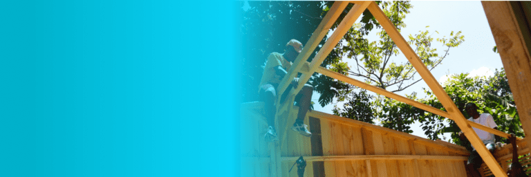 Black men working on a wooden house - Inter American Development Bank IDB - Climate and Change