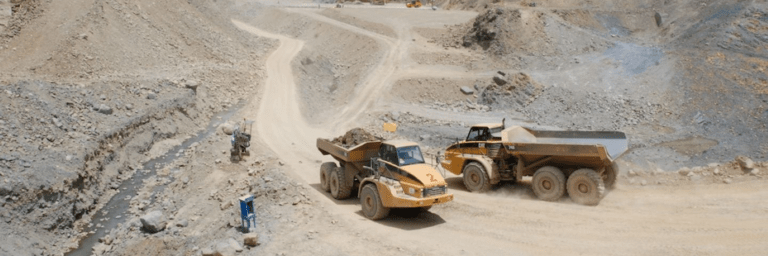 Trucks working in a mine - Regional Integration - Inter American Development Bank - IDB