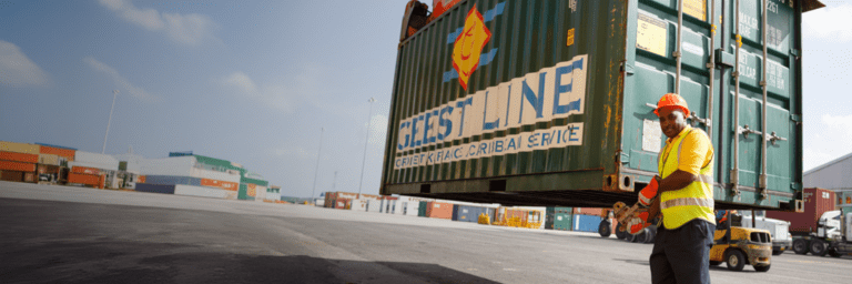 Container arriving to a port with a worker looking to a camera - Inter American Development Bank - IDB