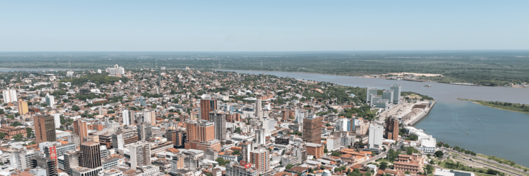 Panoramic day view of a city with a river - Inter American Development Bank - Events