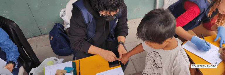 Child registering their finger prints - Social Initiatives- Inter American Development Bank - IDB