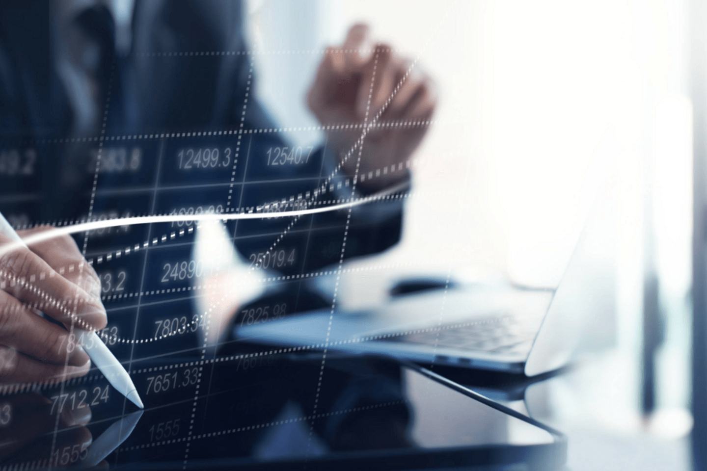 Man analyzing graphs in computer - Macro-Fiscal-Forecasts