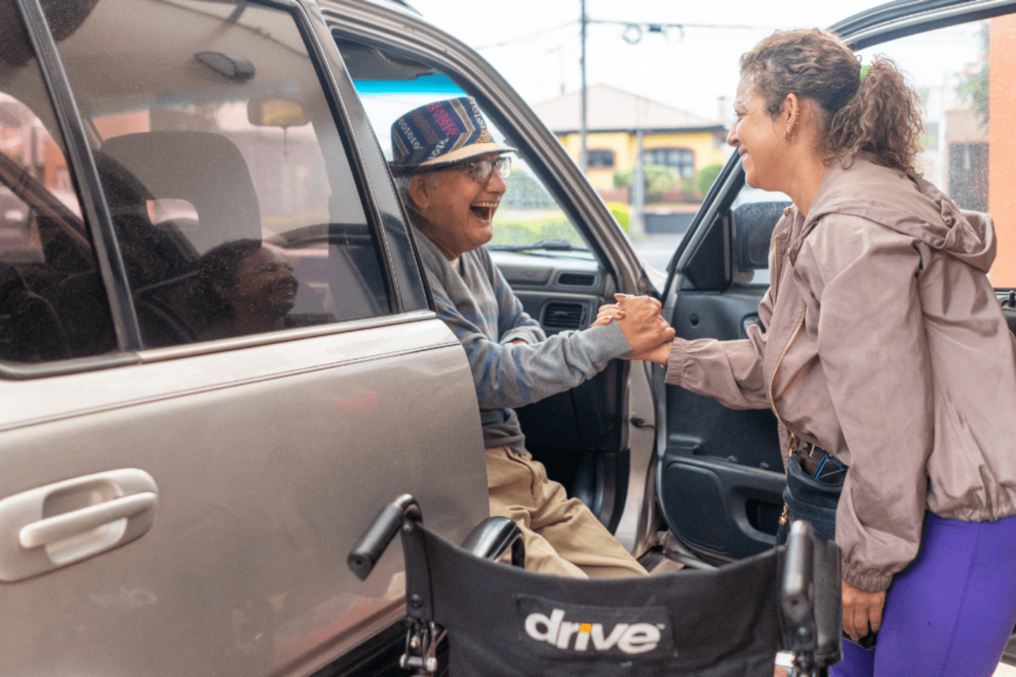 old man getting out of car