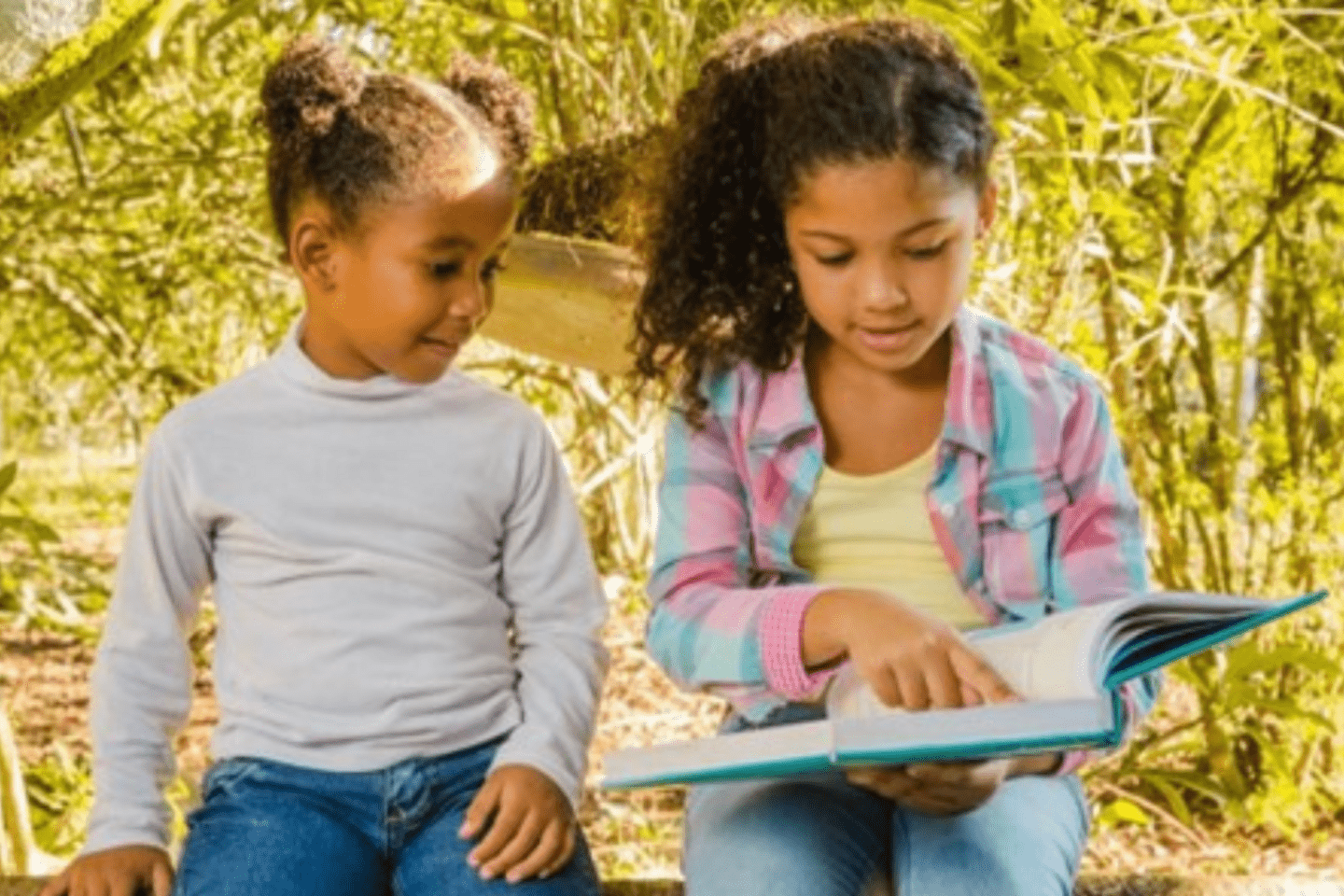 two children reading together