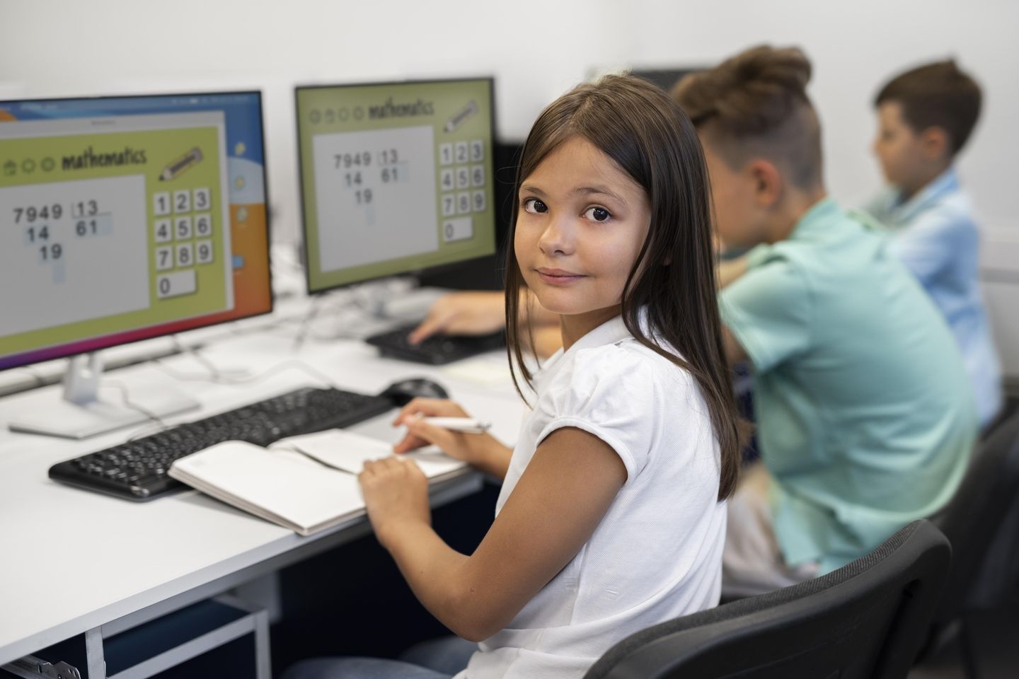 girl using computer in school 
