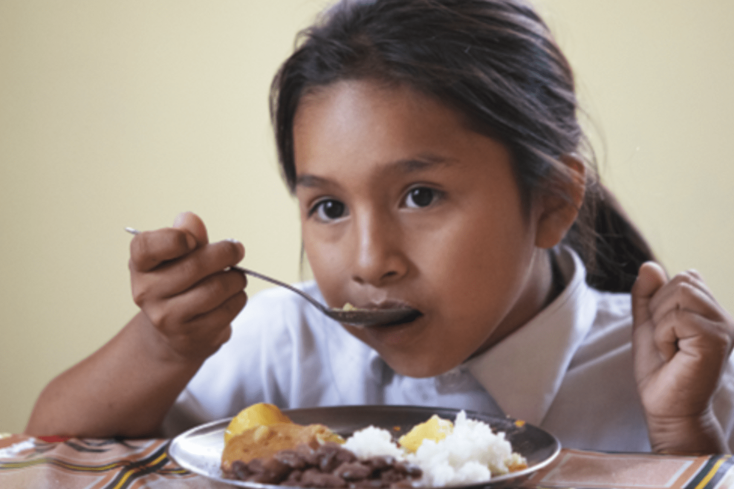 girl eating in school 