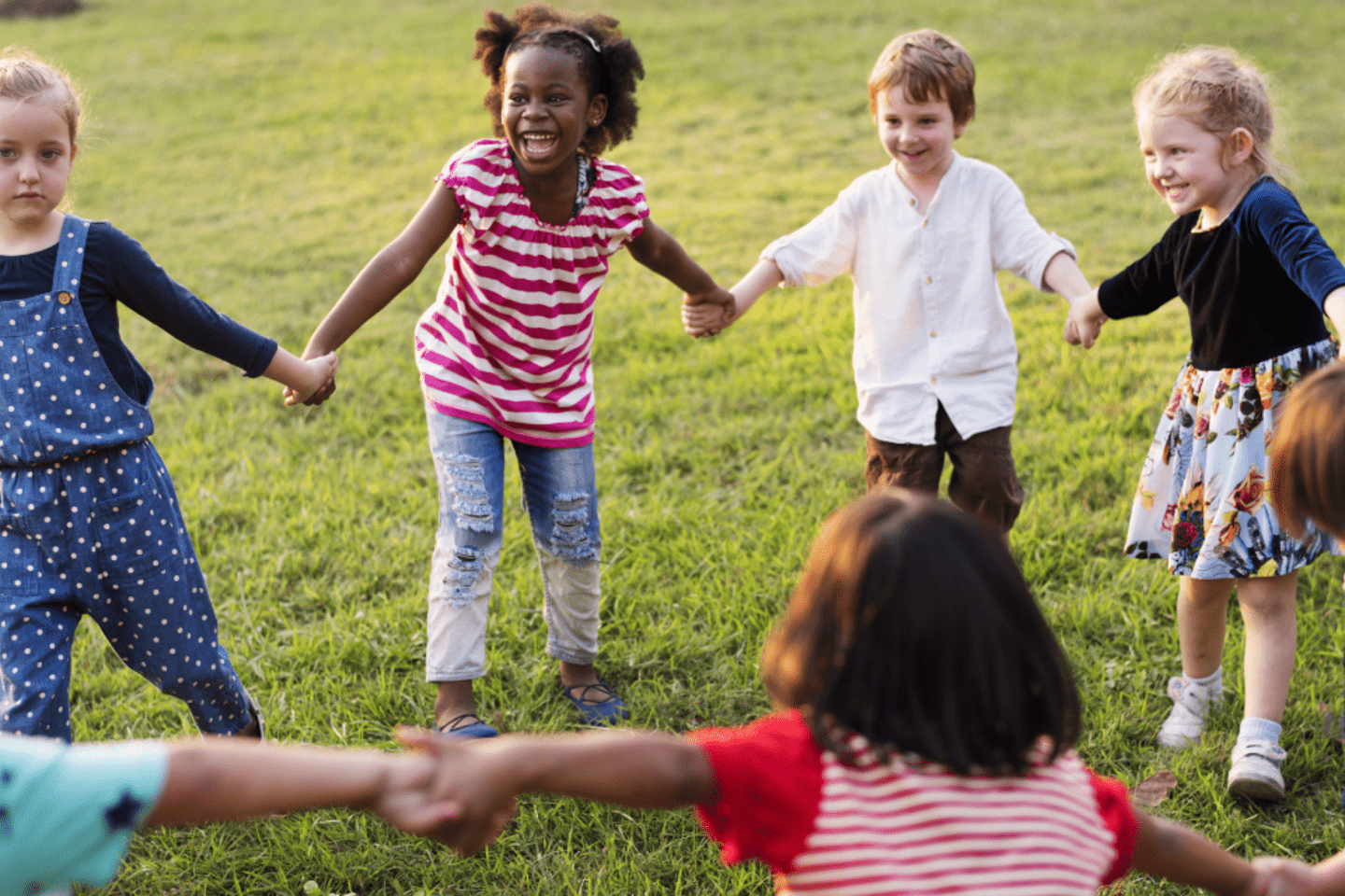 kids holding hands and playing 
