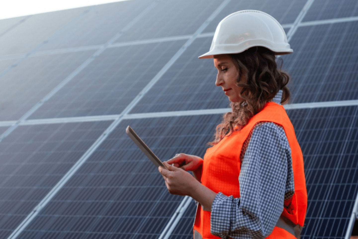 woman working with a solar panel 