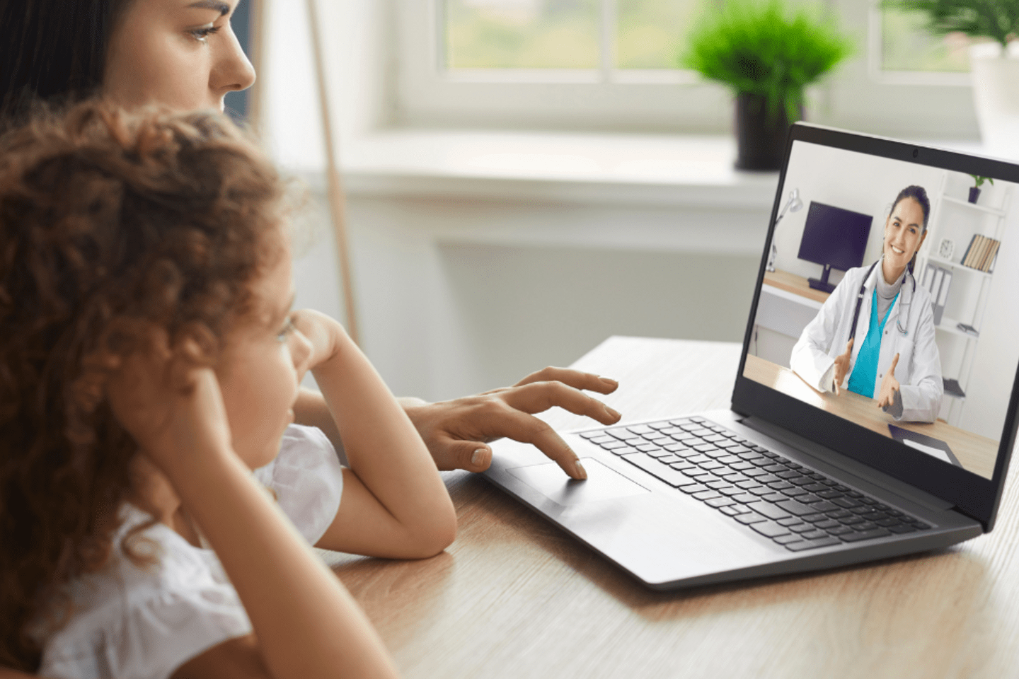 mother and daughter having an online medical appointment 