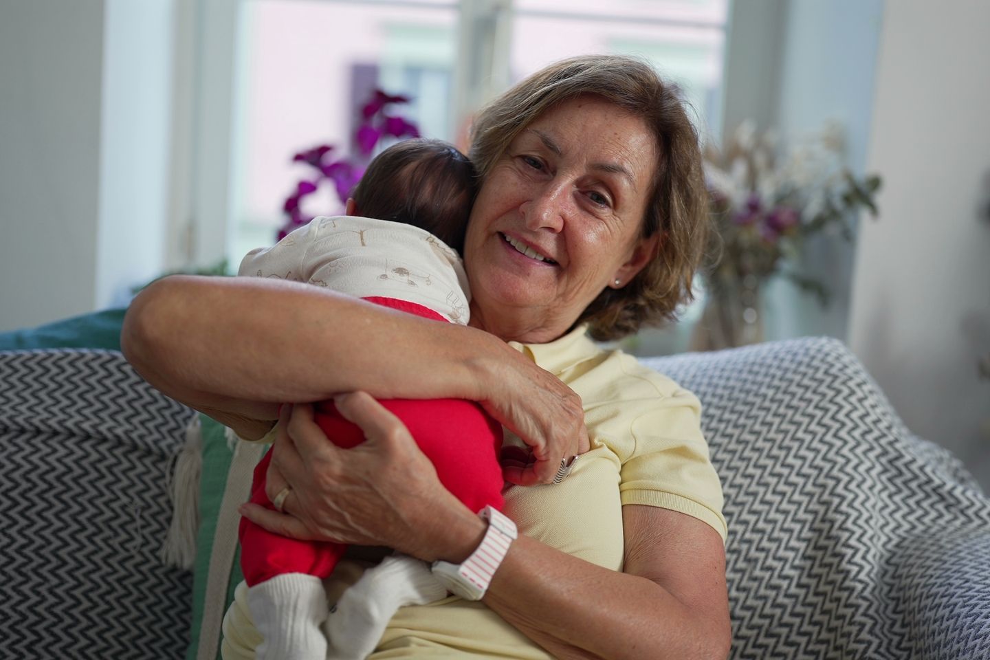 a grandmother holder a baby