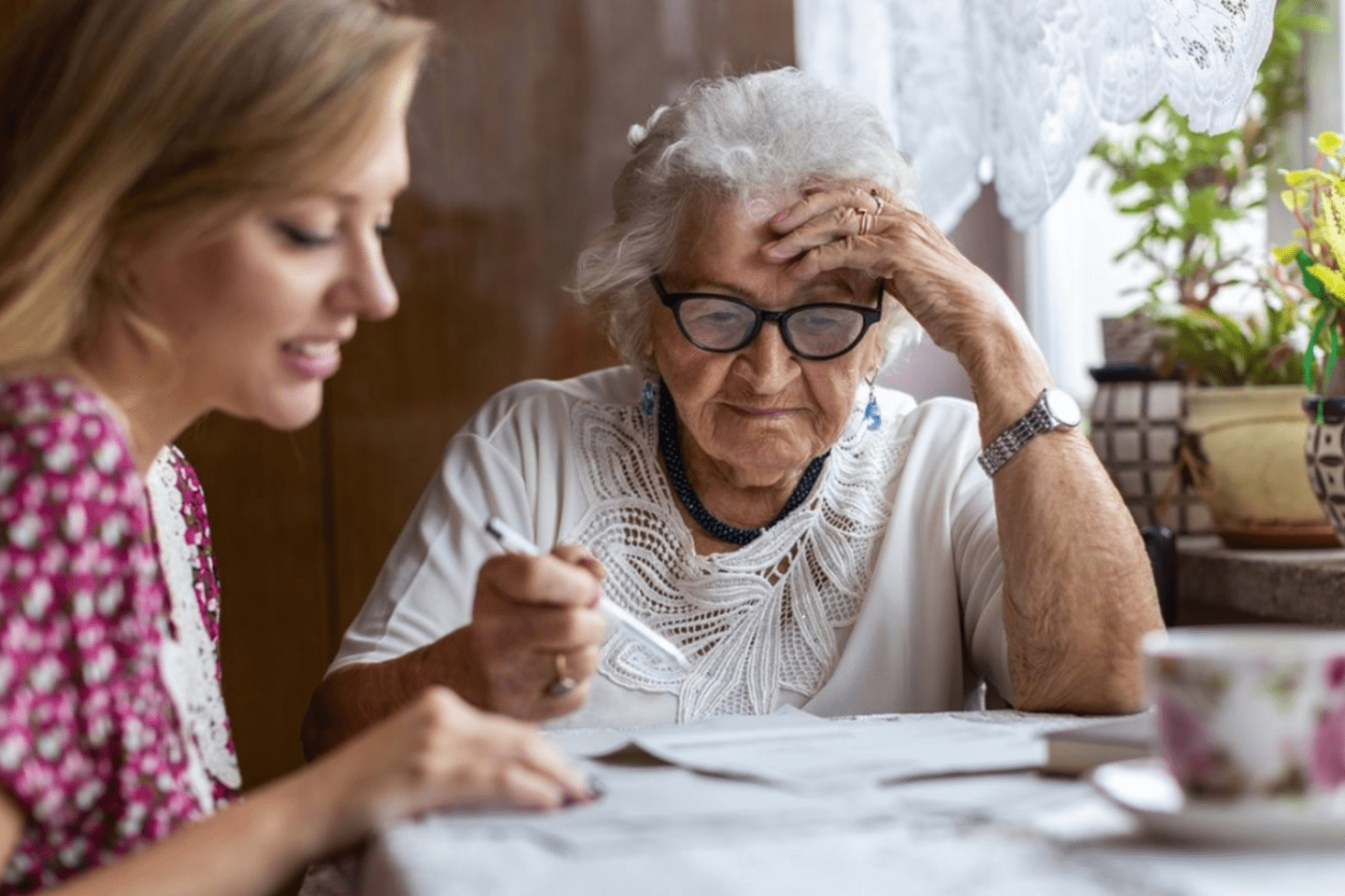 older woman reviews papers 