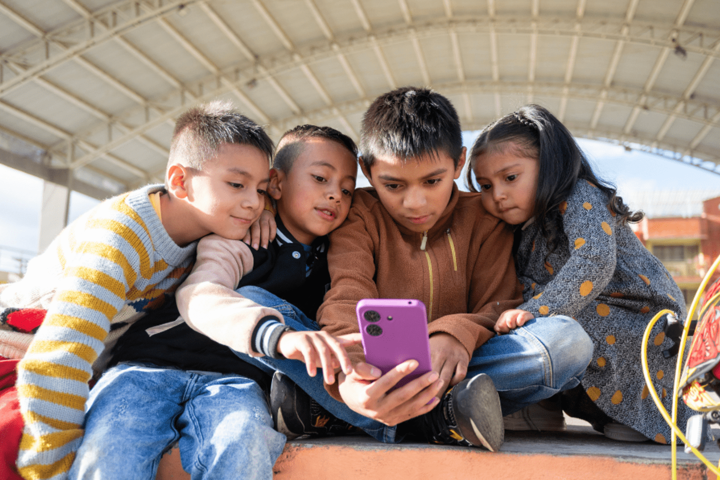 Kids looking at a smartphone 