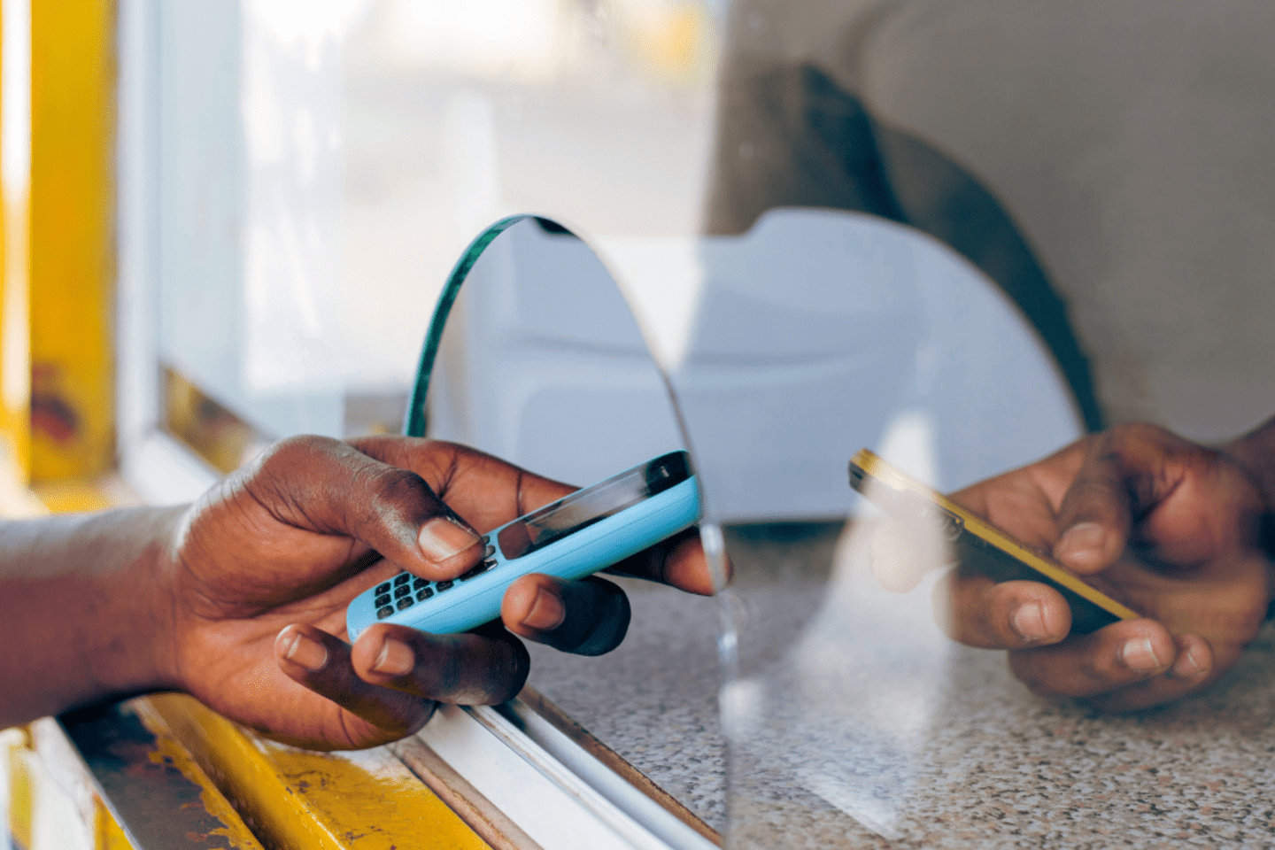 Man using a phone to send money 