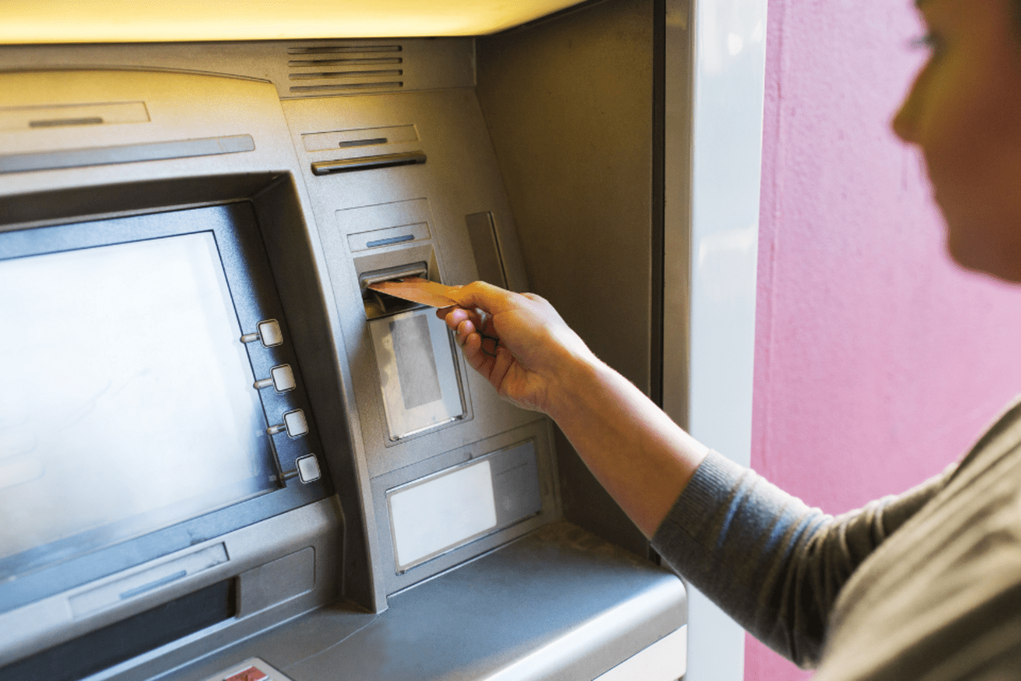 Woman using an ATM machine 