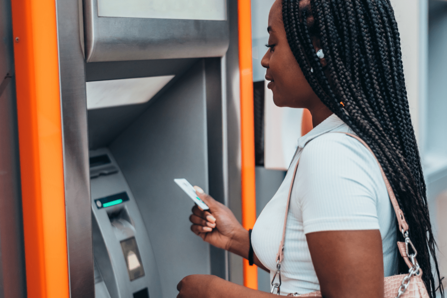 Woman uses an ATM machine 