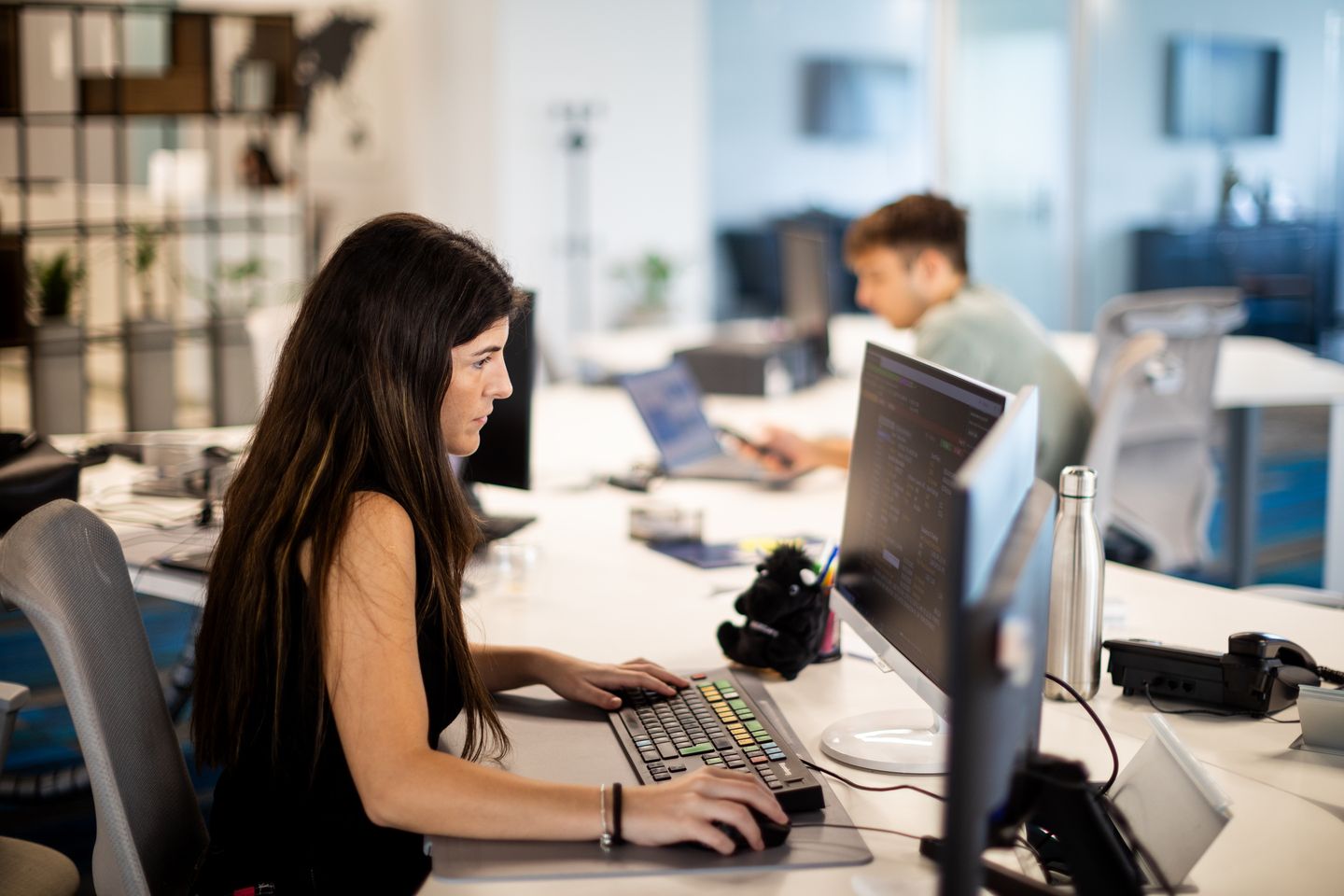 a woman working in front of a computer