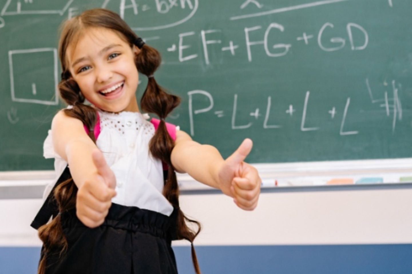 Student with blackboard 