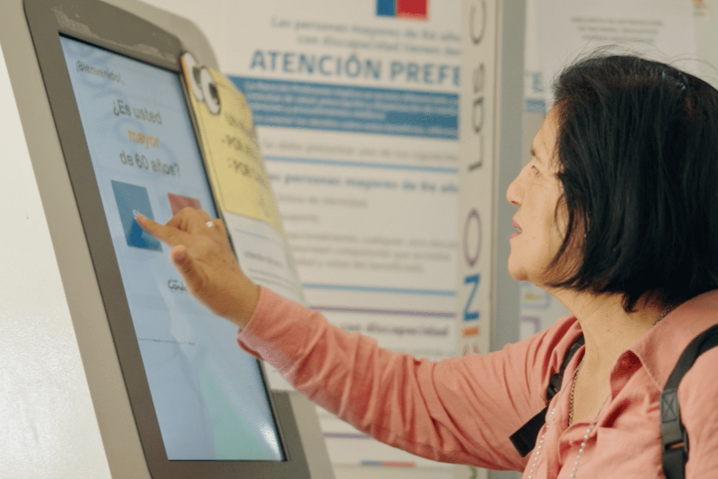 Woman using a screen at a hospital in Chile