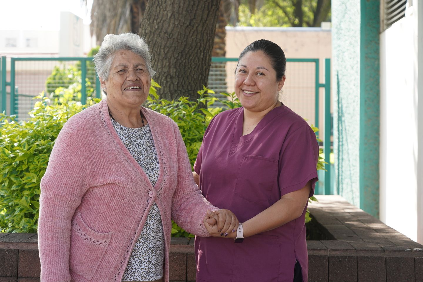 two women holding hands