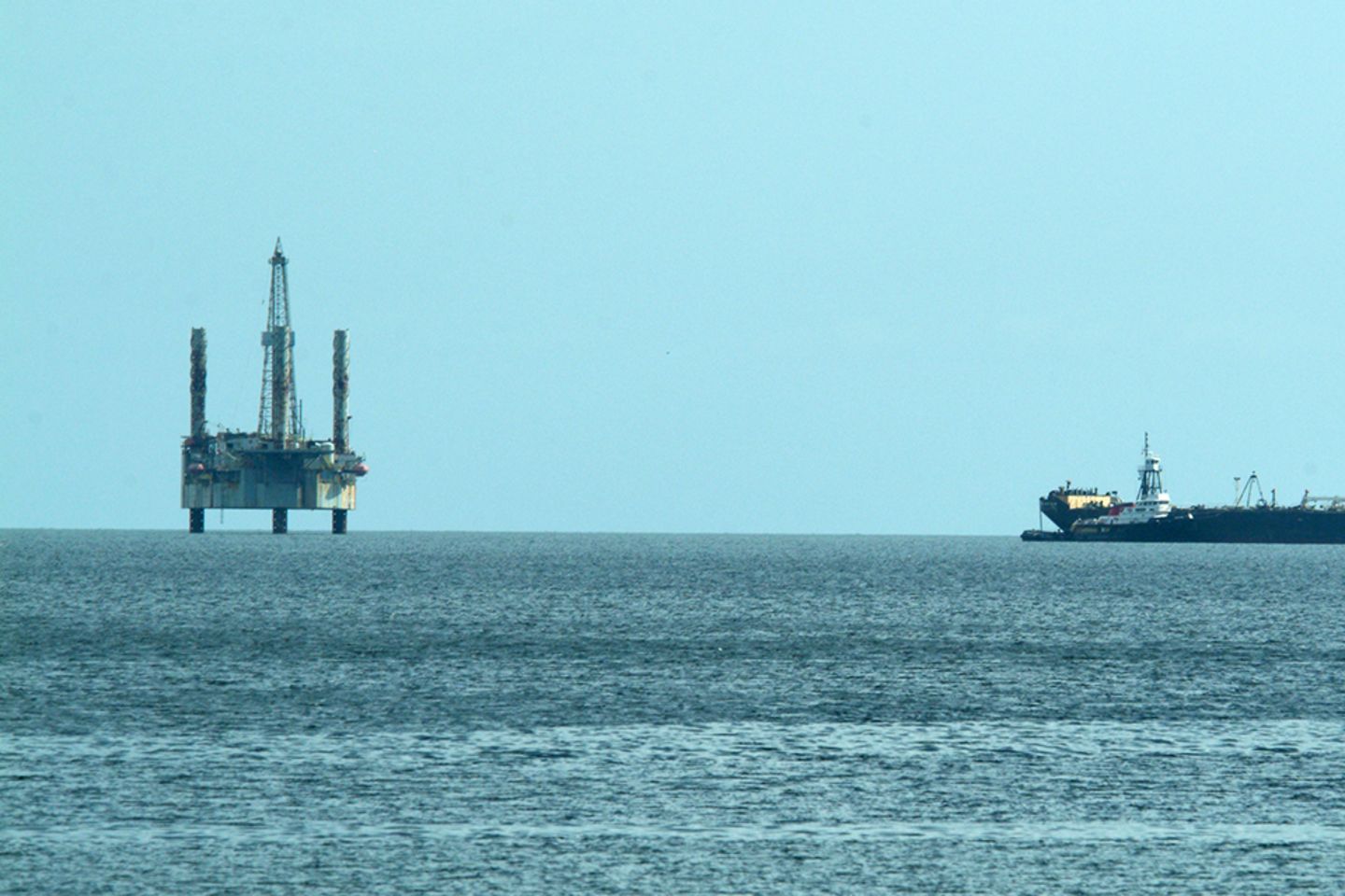 offshore oil drilling platform and oil tanker