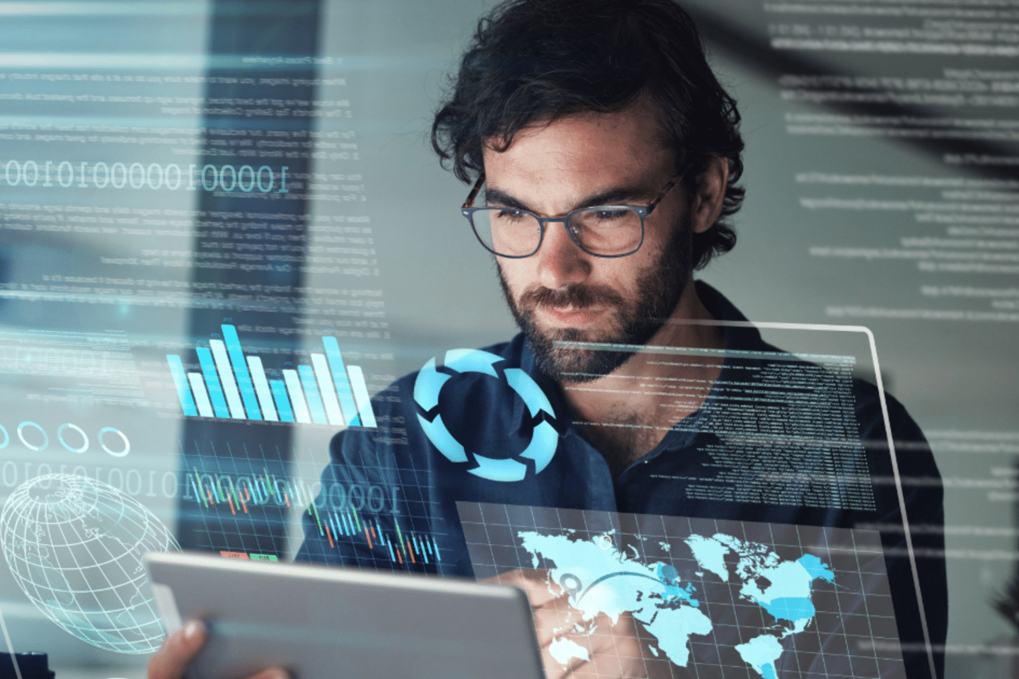 A man looking at digital services stats on a laptop