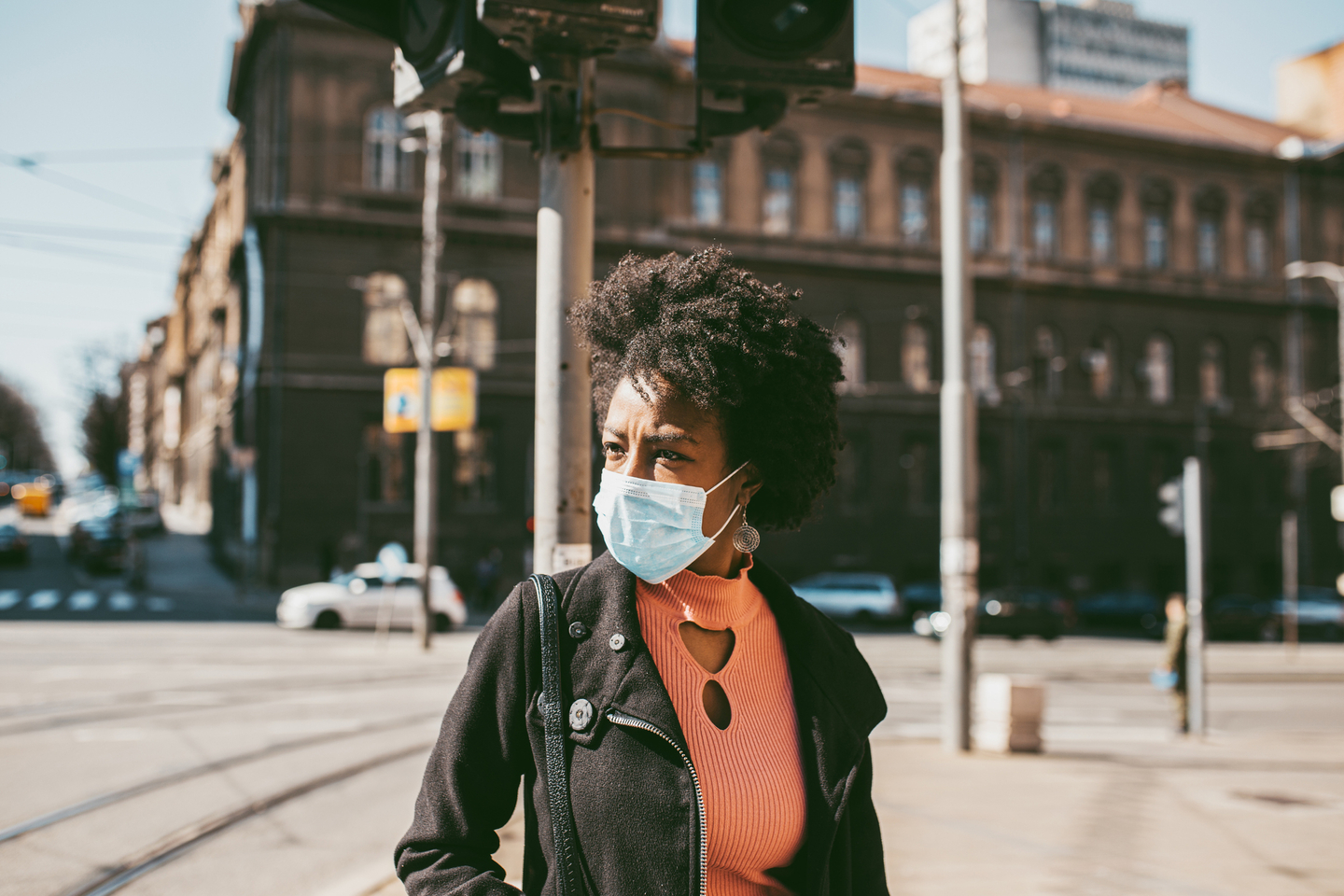Portrait Of Young Woman With Mask On The Street.