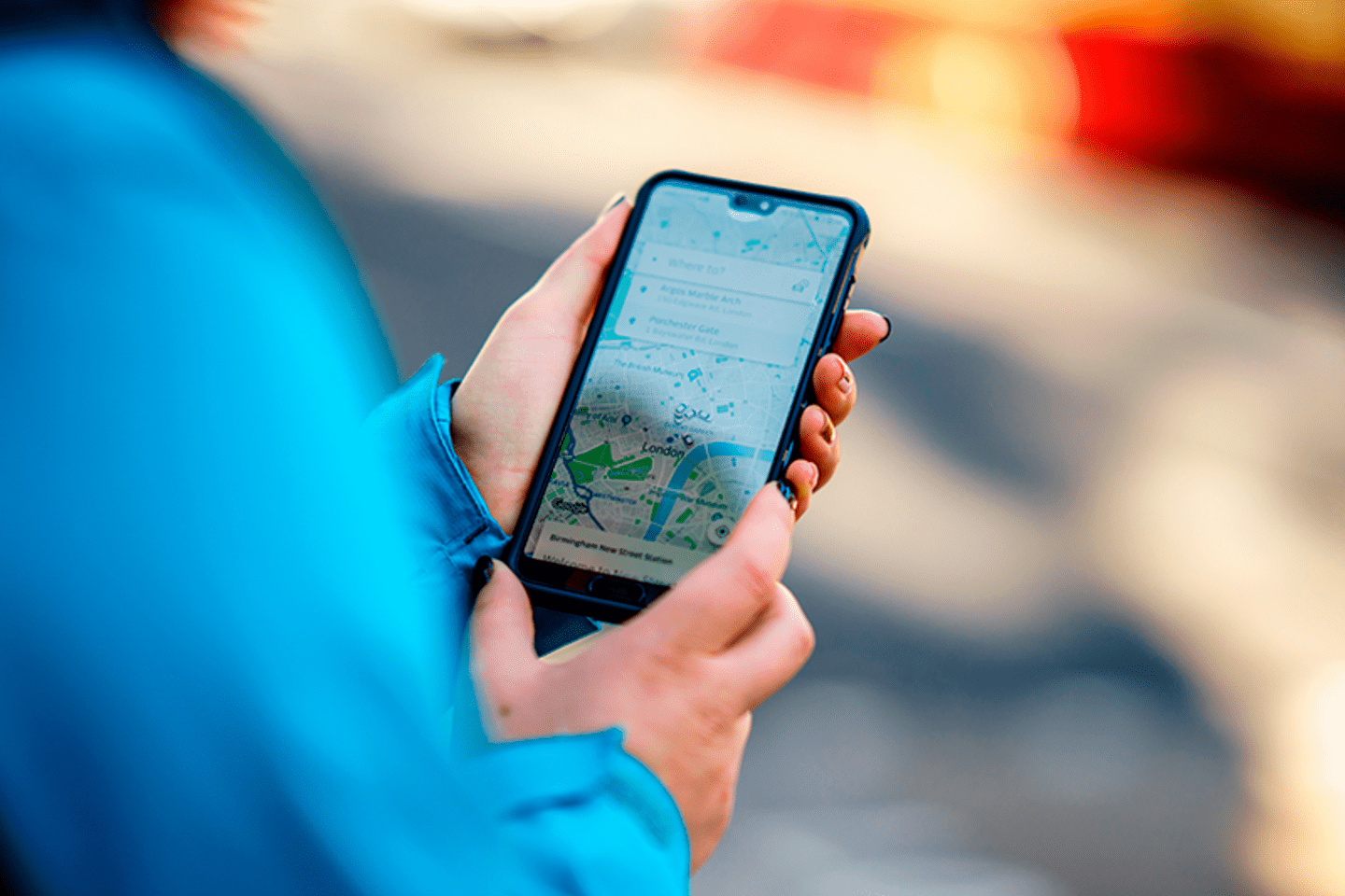 Person using the Uber Taxi App