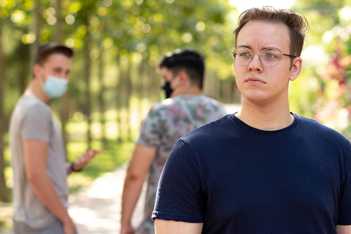 2,People,With,Protective,Masks,Walking,In,The,Park,Are