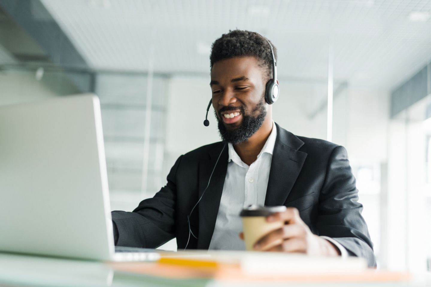 African,American,Customer,Support,Operator,With,Hands-free,Headset,Working,In