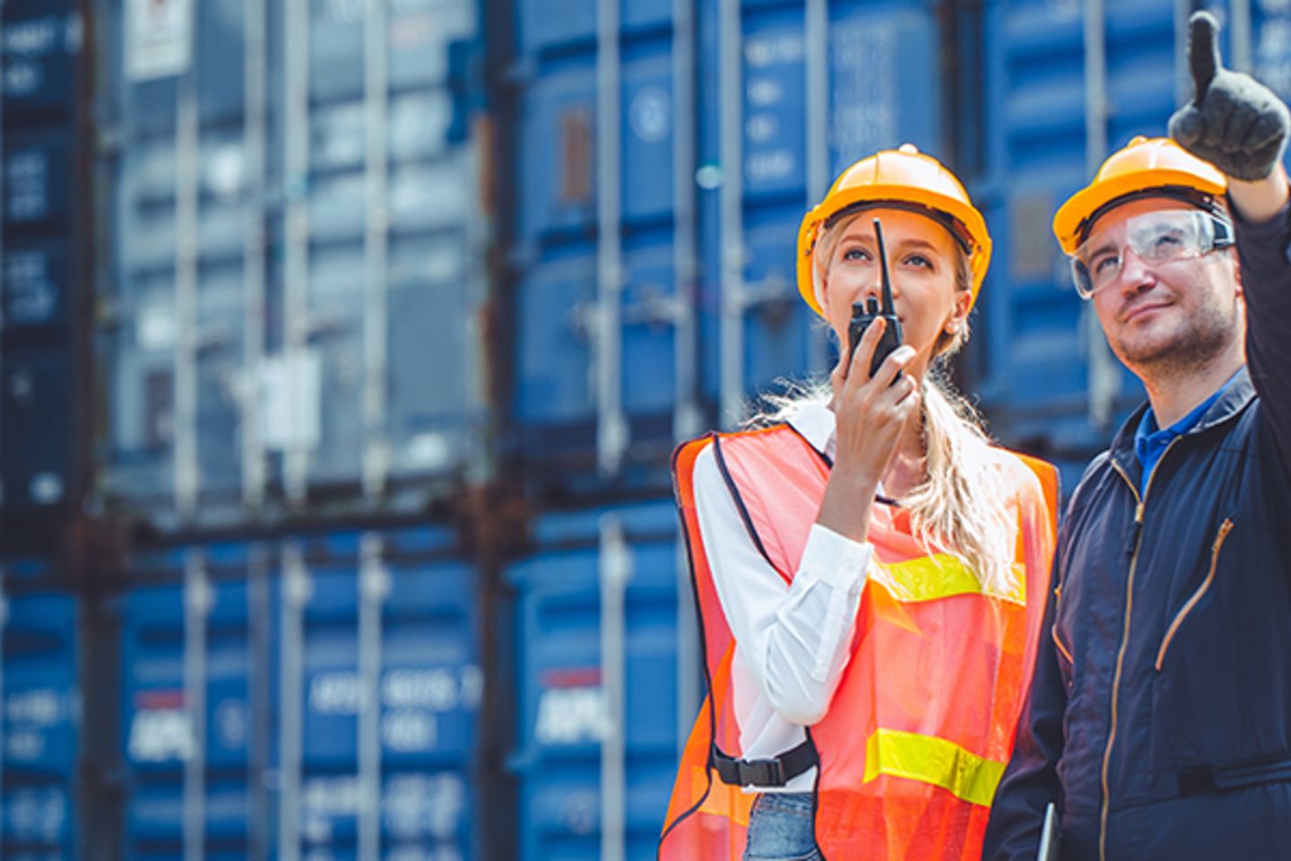 logistic worker man and woman working team with radio control lo