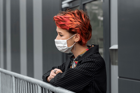 a girl using a covid mask